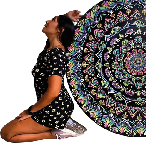 Tanis hincada junto a uno de sus mandalas de puntos, más alto que ella